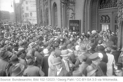 Photo: Depositors clamor to withdraw their savings from a bank in Berlin, 13 July 1931