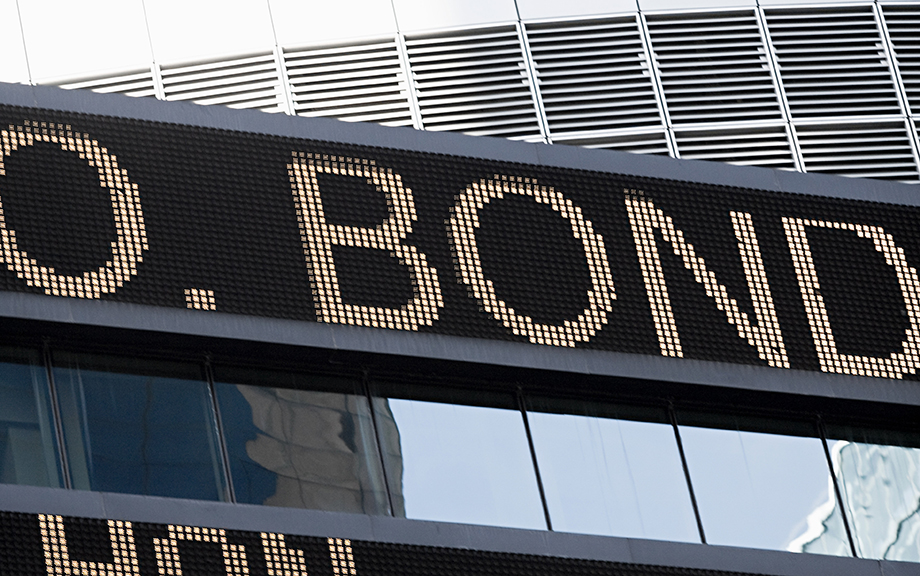 Photo: Ticker sign with the word Bond lit up.