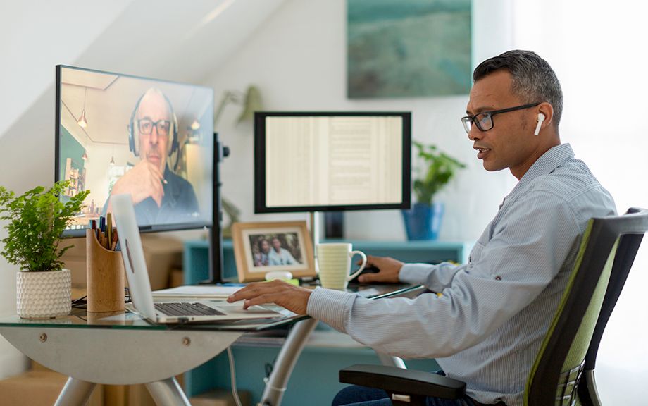 photo decorative: Businessman checking emails while on a video call from his home office