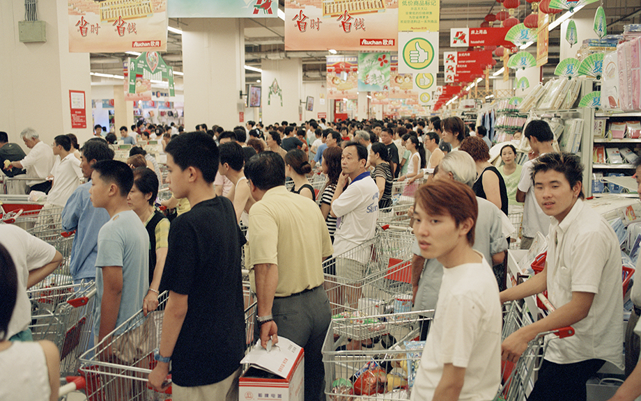 Photo: Chinese shoppers lining up to buy shopping carts full of items within a store