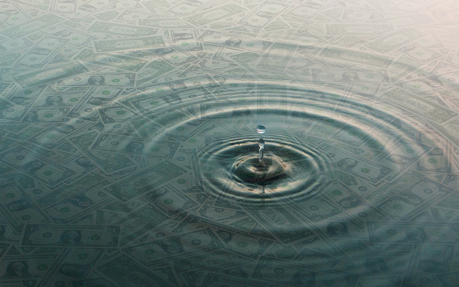 Decorative photo: dollar bills and ripples and drop of water over them
