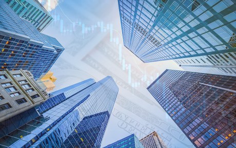 decorative image: skyscrapers with overlay of a 100 dollar bill and line graph