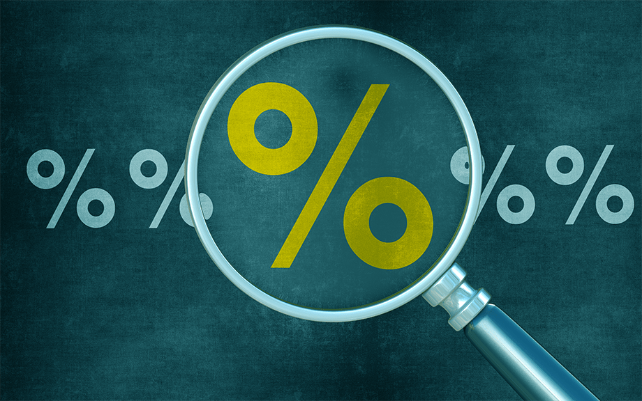 Decorative image: Magnifying glass over a percent sign on green background.