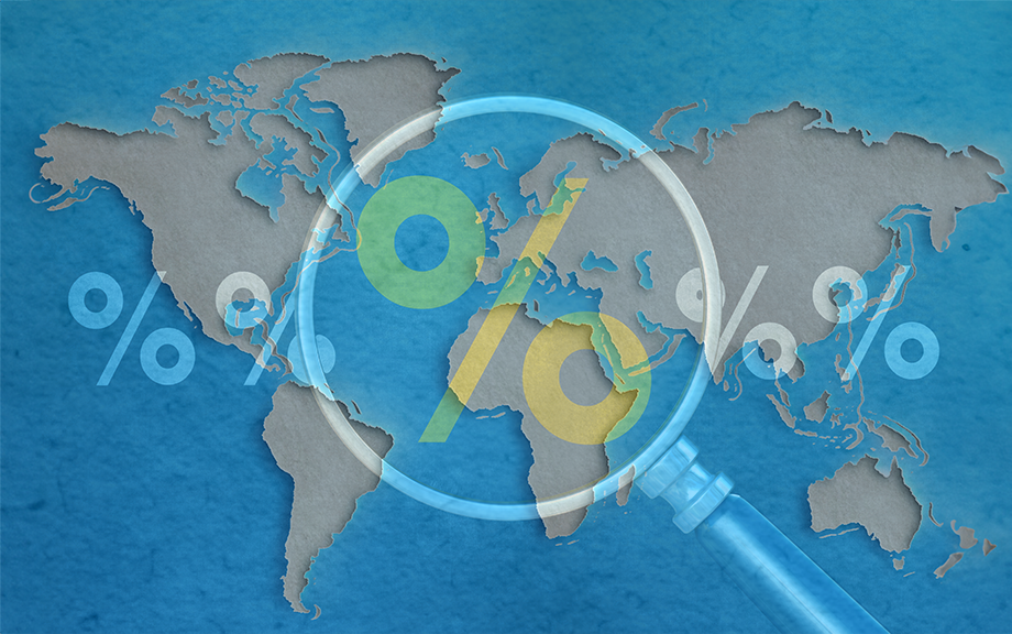 Decorative image: Magnifying glass over a percent sign on flattened world map background.