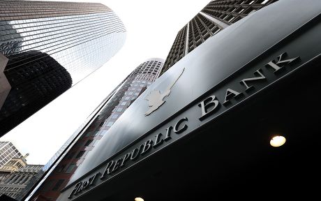 decorative image: first republic bank building photographed from the ground looking up toward the sky with a few tall buildings next to it.