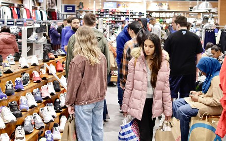  Americans shopping inside a store.