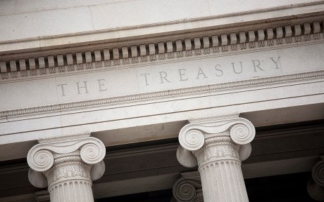 Decorative photo: close up of the words "The Treasury" on the treasury building showing the top of the columns outside the structure.
