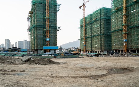  Construction site of three tall building towers with threes crane