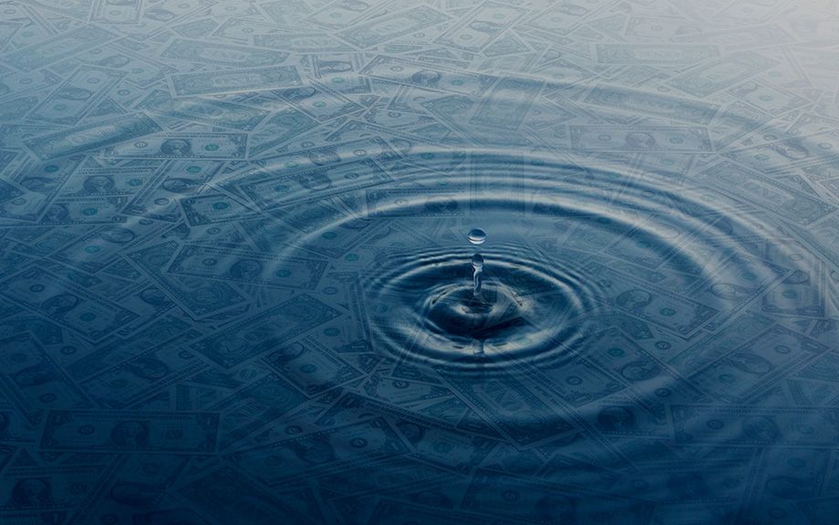 Decorative image of a drop of water hitting a pool of water with dollar bills under the water.