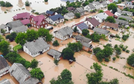 Decorative image: Aerial view river that flooded the city and houses. Flooded houses in the water.