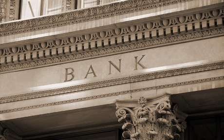Photo of old bank building with columns.