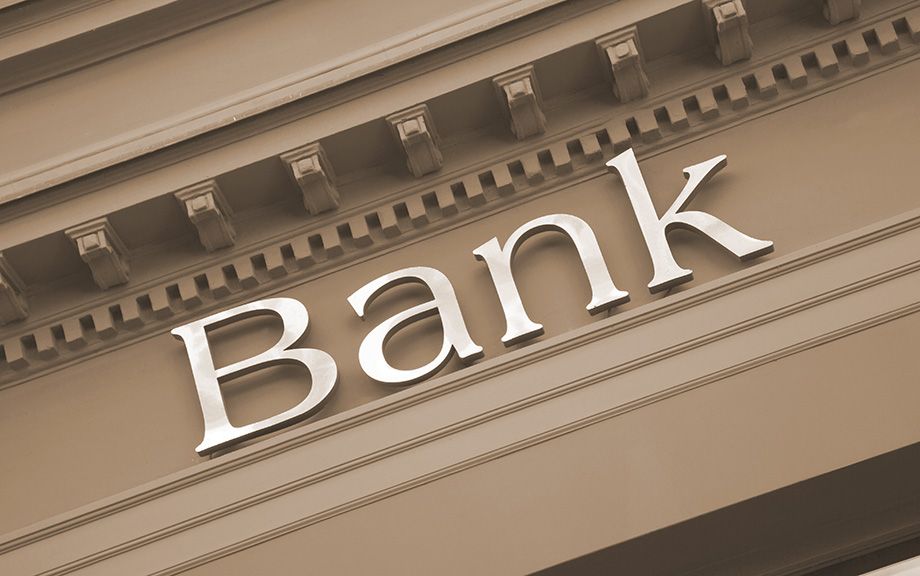Photo: generic image of the word Bank on an old building facade.