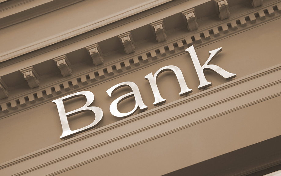 Photo: generic image of the word Bank on an old building facade.