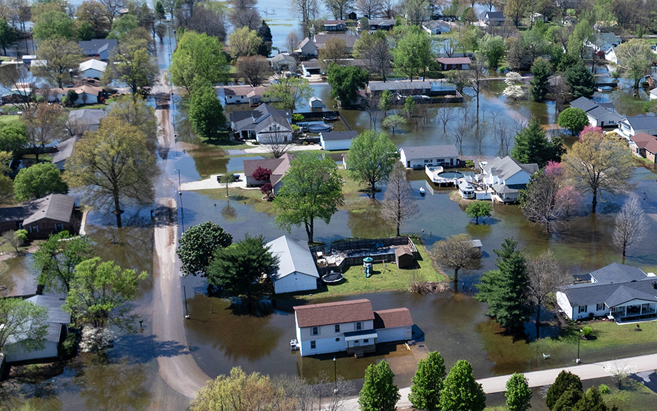 An aerial view shows floodwater surrounding homes on April 07, 2025 in East Prairie, Missouri. Thunderstorms, heavy rains, high winds and tornadoes have plagued the region for the past several days, causing widespread damage before moving east. (Photo by Scott Olson/Getty Images)
