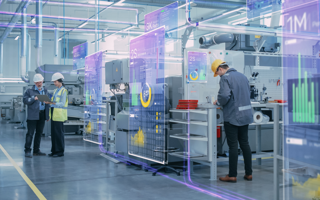 Photo: Factory Digitalization: Two Industrial Engineers Use Tablet Computer, Big Data Statistics Visualization, Optimization of High-Tech Electronics Facility. Industry 4.0 Machinery Manufacturing Products