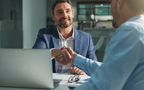 Business people, handshake and interview success or recruitment, employment and hiring in office. Corporate, men and executive shaking hands with new employee or collaboration on deal or partnership.