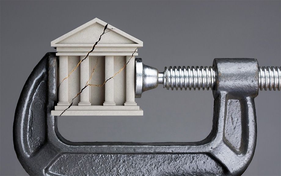 image of a bank crumbled within a wrench