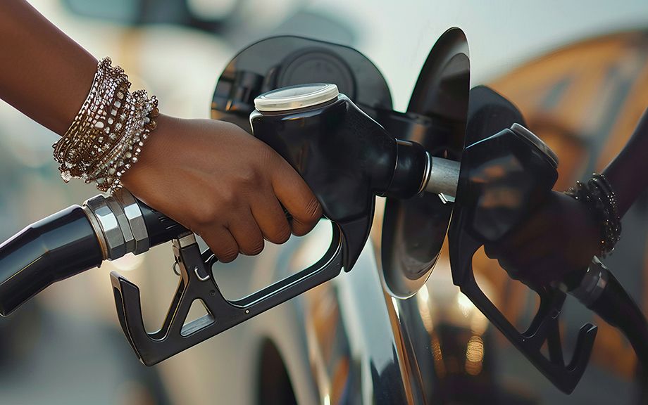 AI generated: Hand Of A Woman Pumping Gas Into A Vehicle