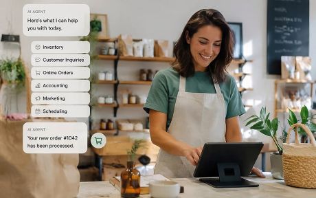 AI generated image of small businesswoman looking at her computer screen and on the image is the AI response on how it can help her with online orders, inventory, customer inquiries, etc.